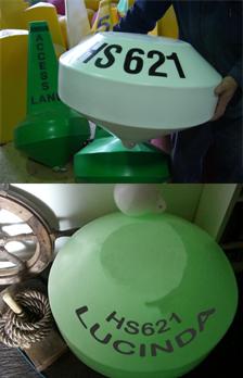 Mooring buoy in white and fluorescent.